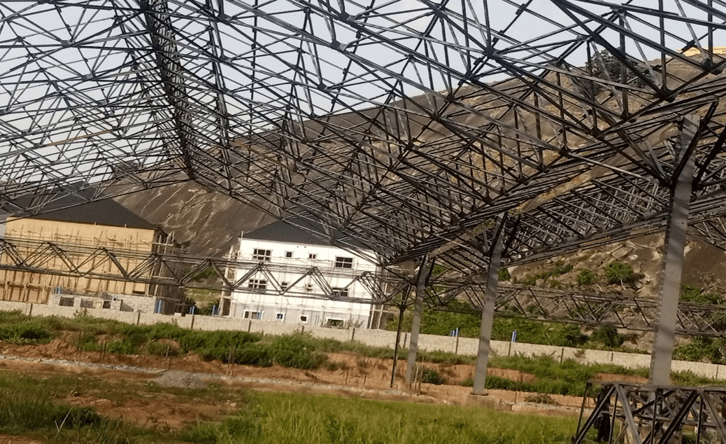 B. Sky view of the Roof from inside showing roof details & the side view of the Trailer offloading Canopies.
                            .